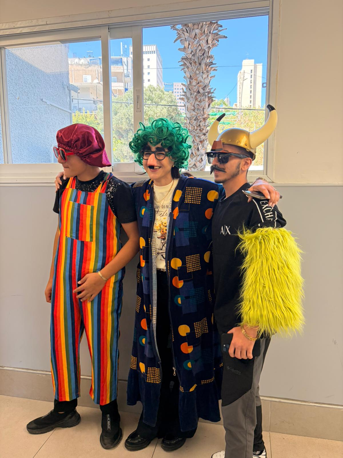 Participants standing together in costume during a group activity in a school room.