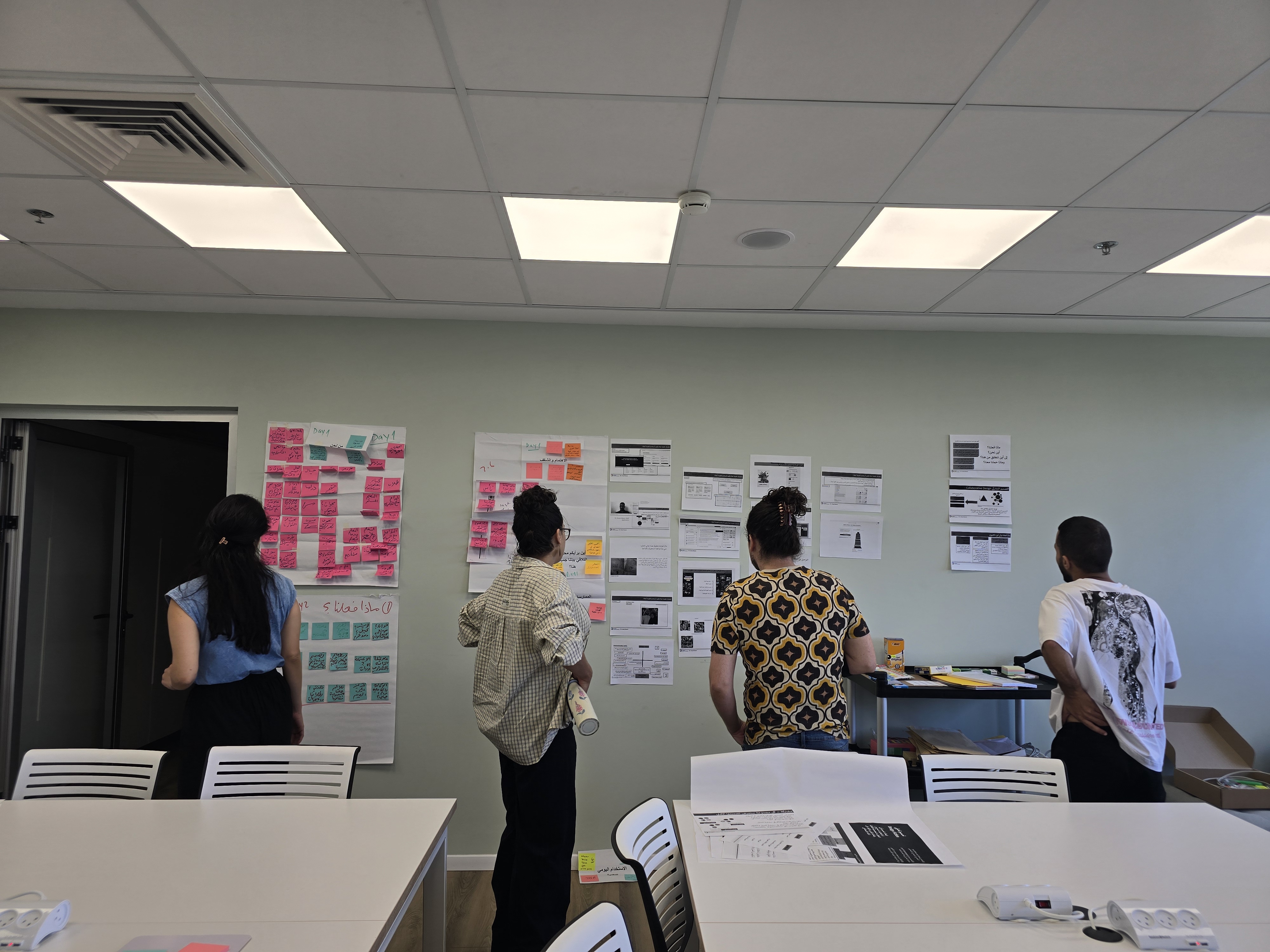 Facilitators at work during a co-design training session, June 2026.